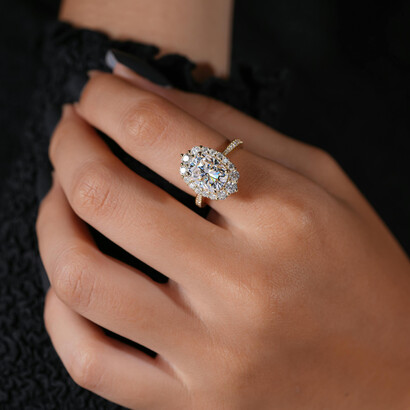 Close-up of a model’s hand adorned with an elegant lab-grown diamond ring