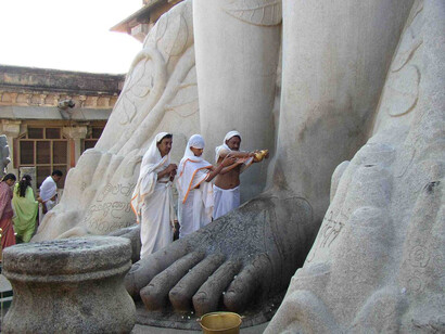 Prayers being performed at Lord  Bahubali or Gomateshwara Statute