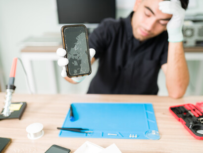 A phone with a broken screen waiting to be repaired. In the U.S., only around 16% of people fix their phones instead of replacing them altogether