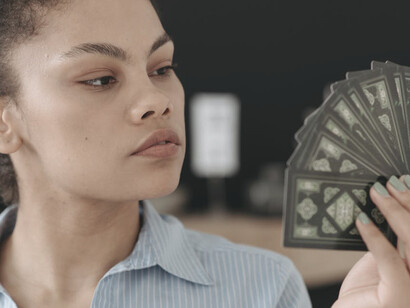 With tarot cards in hand, she embraces the transformative energy of Pluto, reflecting on how traditional power structures are being challenged and reshaped in this new era
