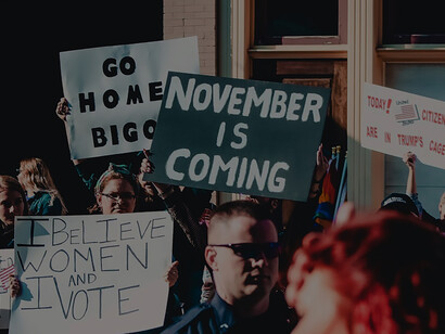 Citizens assemble near building, displaying banner in anticipation of US elections