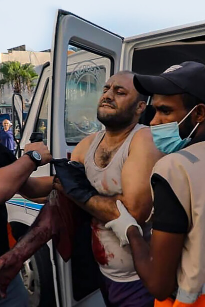 A powerful photograph capturing the devastation and casualties in the Gaza Strip during the 2023 conflict