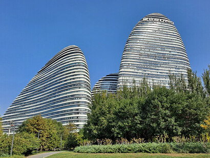 The iconic curves of Wangjing SOHO, designed by Zaha Hadid Architects, define the skyline of Beijing's Wangjing technology and creative district