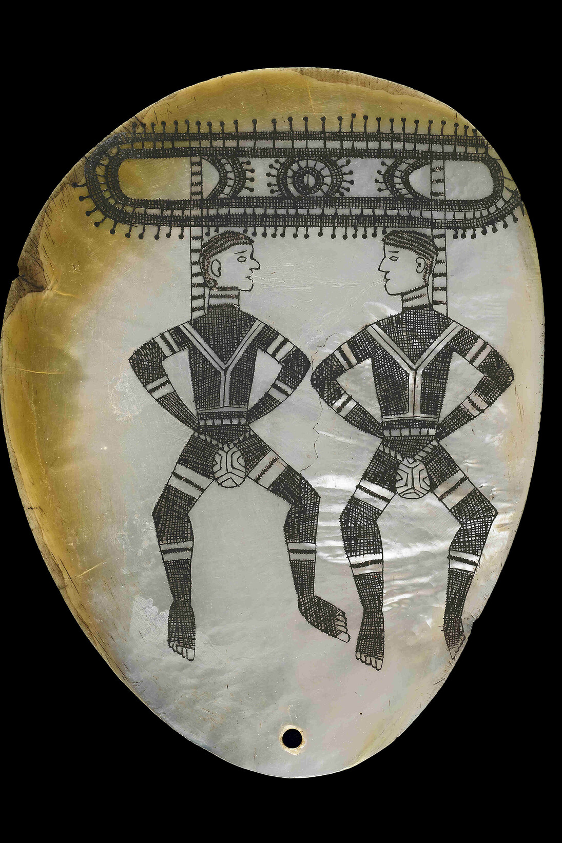 Pearl shell pendant with dancing figures. Kimberley region, Western Australia, before 1926, Pearl shell, charcoal © The Trustees of the British Museum