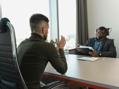 A candidate being interviewed by a human resources representative 