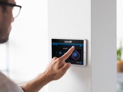 A close up of a smart home interface enabling seamless control of music and other smart features 