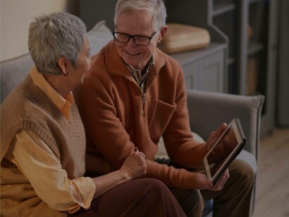 A couple rejoicing at their finances in the silver economy