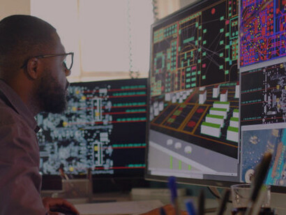 A man is actively working on coding projects