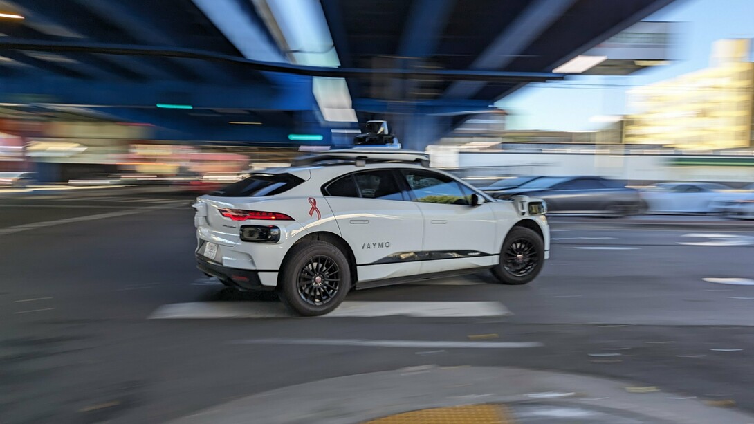 A sleek Waymo robotaxi cruises through San Francisco, symbolizing the city’s leap into an autonomous driving future