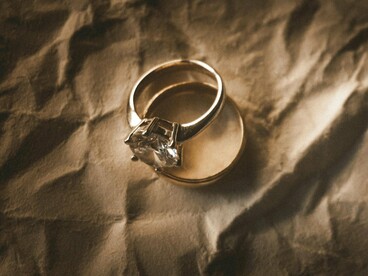 Wedding bands displayed together, reflecting the social expectations and traditions surrounding marriage