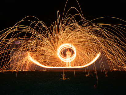 A person doing steel wool photography; energy and matter are inseparable
