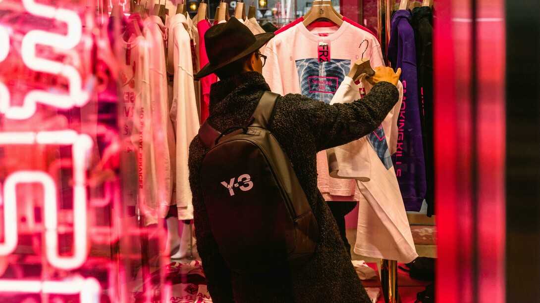 Man browsing for clothes and secondhand apparel