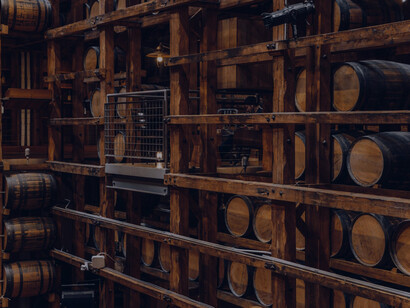 Barrels of wine quietly maturing in the winery's dimly lit cellar, imparting their unique flavors and character to the aging process