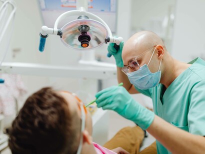 Dentist checking patient for oral hygiene