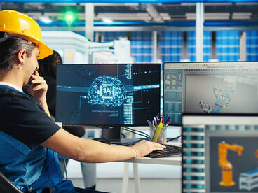 Factory engineer working with an AI system to improve solar panel efficiency