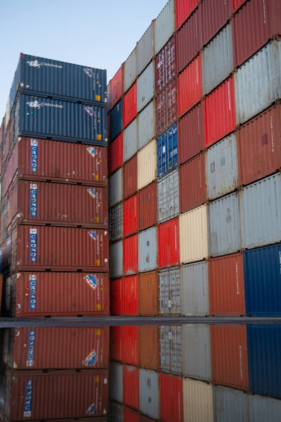 Intermodal containers, proudly displaying the vibrant colors of red, blue, and yellow, all manufactured in China