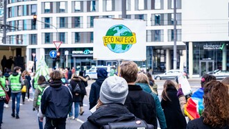 Man holding sign for the Fridays for Future Bonn, global environment protest, 2021