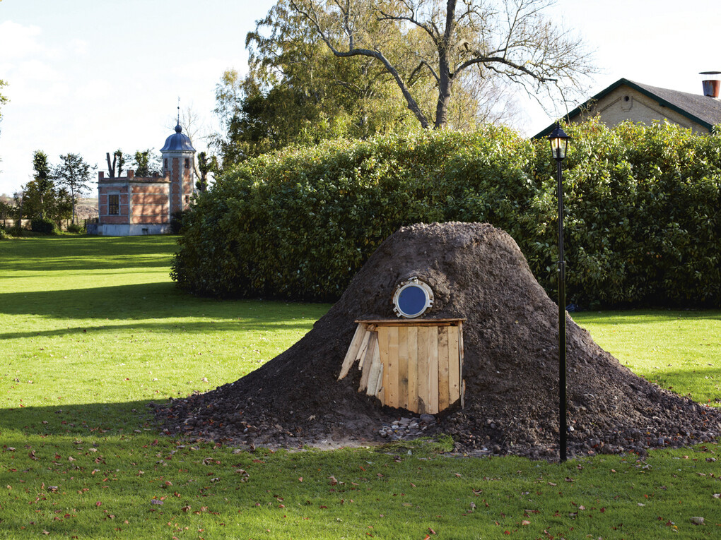 Hartmut Stockter, The Mole's Defence Academy, 2011, man-size molehill with window and lantern