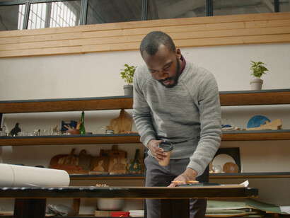 Surrounded by digital tools, the architect exemplifies the fusion of creativity and technology, using AI to streamline compliance with evolving building codes and regulations