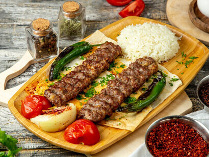 Adana kebab with rice and vegetables