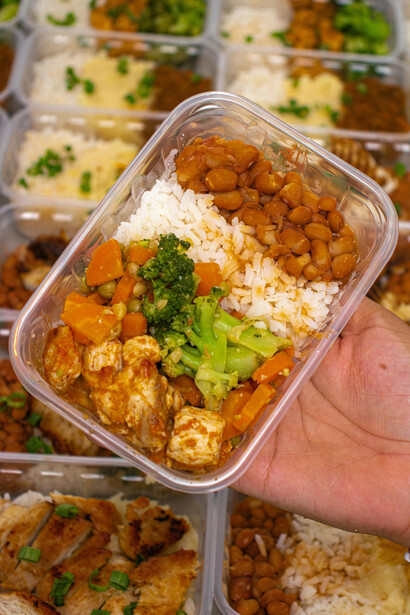 Healthy meal prep featuring rice and fresh vegetables