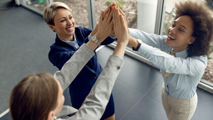 A group of employees sharing a happy moment during work hours