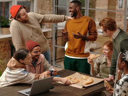 Multi racial group of friends laugh together