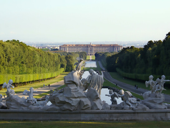 The Royal Palace of Caserta seen from the fountain of Venus and Adonis inside the Royal Park, Italy