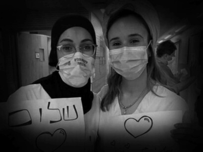 Jewish and Arab medical staff at Haifa’s Rambam Health Care Campus offer a message of solidarity