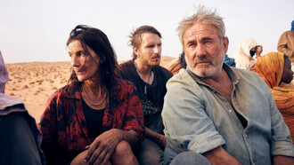 Sergi López, Joshua Liam Herderson, Stefania Gadda in una scena del film "Sirat", diretto da Oliver Laxe