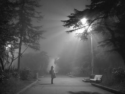 A girl looks up at the unusual lights in the sky