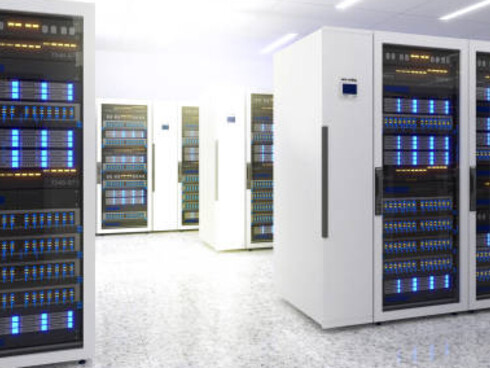 An image of a modern data center, showcasing multiple rows of active server racks, complete with efficient cooling systems, telecommunications infrastructure, and 3D-rendered server room details