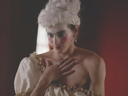 A man strikingly clad in women's clothing, exuding theatrical flair and pushing the boundaries of sartorial expression