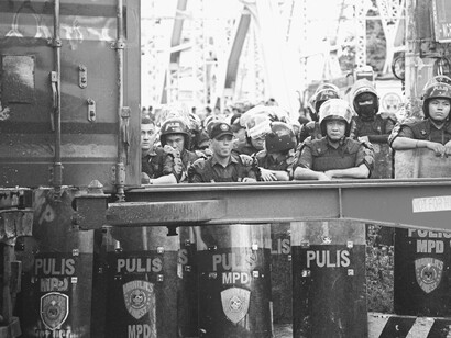 A group of police officers patrolling a modern city, reflecting themes of a police state, Philippines