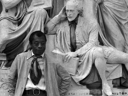 James Baldwin at the Albert Memorial, with the statue of Shakespeare in the background