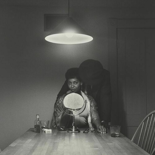 Carrie Mae Weems, Untitled (Man and mirror) (from Kitchen Table Series), 1990, Gelatin silver print, 27 1/4 x 27 1/4 inches (69.2 x 69.2 cm), Collection of Eric and Liz Lefkofsky, Promised gift to The Art Institute of Chicago © Carrie Mae Weems. Photo: © The Art Institute of Chicago