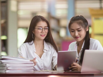 Students engaged in thoughtful study, reflecting the discipline that transforms adversity into purpose