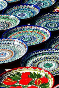 Colorful traditional mosaic plates crafted by local artisans in Bukhara, Uzbekistan