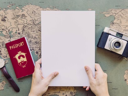 A blank page, a passport, and a camera—the essential trio for writing one’s own journey
