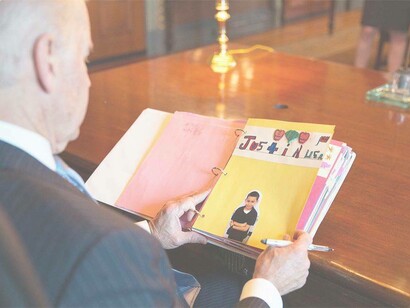 President Joe Biden receiving his "fan mail" and eagerly looking at all the reaction