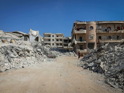 A city destroyed by war. War destroys people and places 