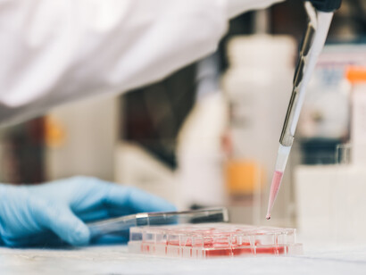Close up of a scientist despositing samples on tubes