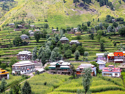Traditional hillside huts dot the landscape of Neelam Valley in Azad Kashmir