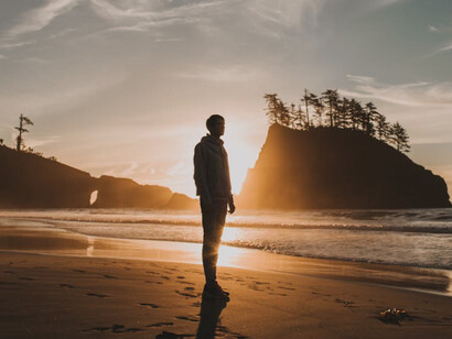 The serene solitude of the beach at sunset mirrors the introspective journey of discovering one's authentic self, away from the scrutiny of everyday life