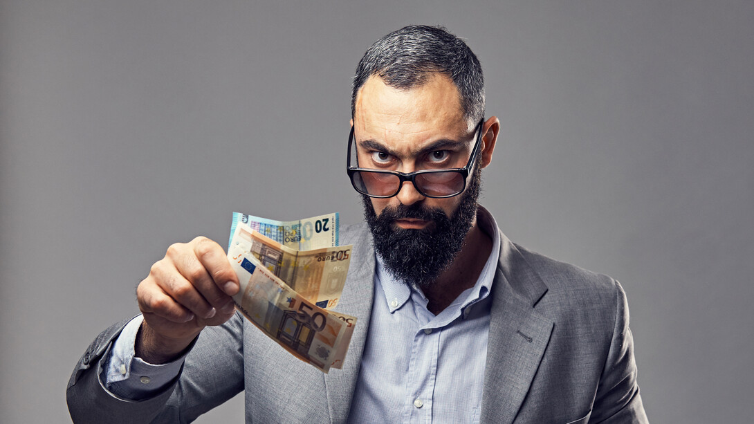 In the face of rising living costs, this CEO's menacing stare seems to mock the struggles of the everyday person, offering hollow solutions while continuing to amass power and profit