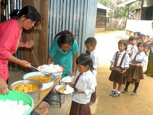 Children being served food under the Mid-day Meal Scheme at a primary school, Wokha district, India