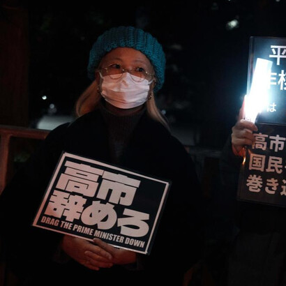 Activists chant outside the PM’s home in Tokyo, Japan, urging leaders to prioritize dialogue amid rising tensions with China