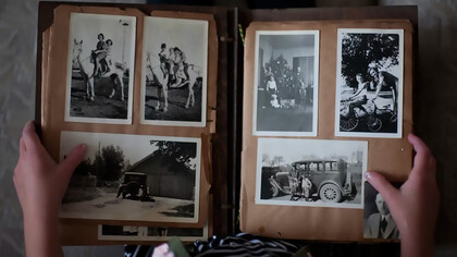 A weathered photo album filled with faded memories