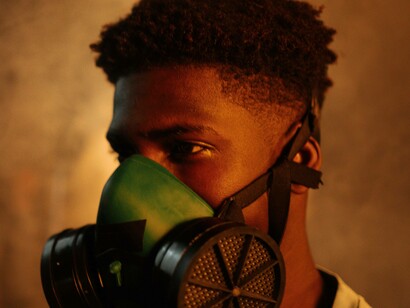 The gas mask is being used by this man after the aftermath of a climate disaster 