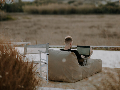 A man working on his laptop while on vacation
